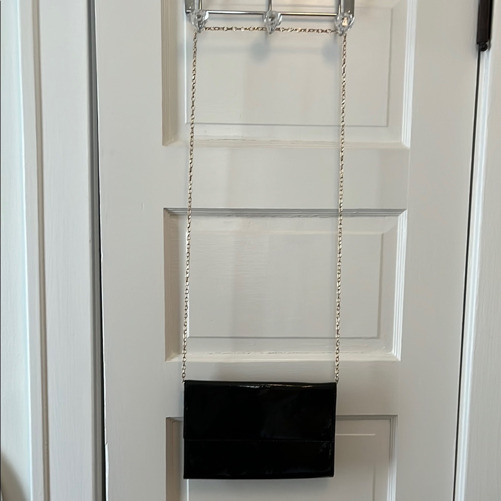 Black patent leather clutch bag